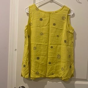 Yellow sleeveless blouse